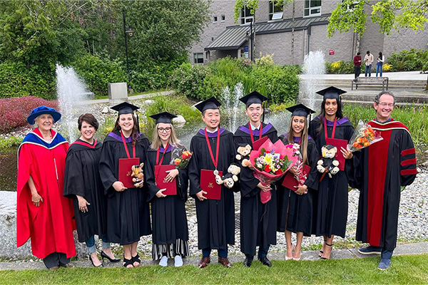 Gavilanez with Faculty and Students at the Spring 2022 Convocation Ceremony.