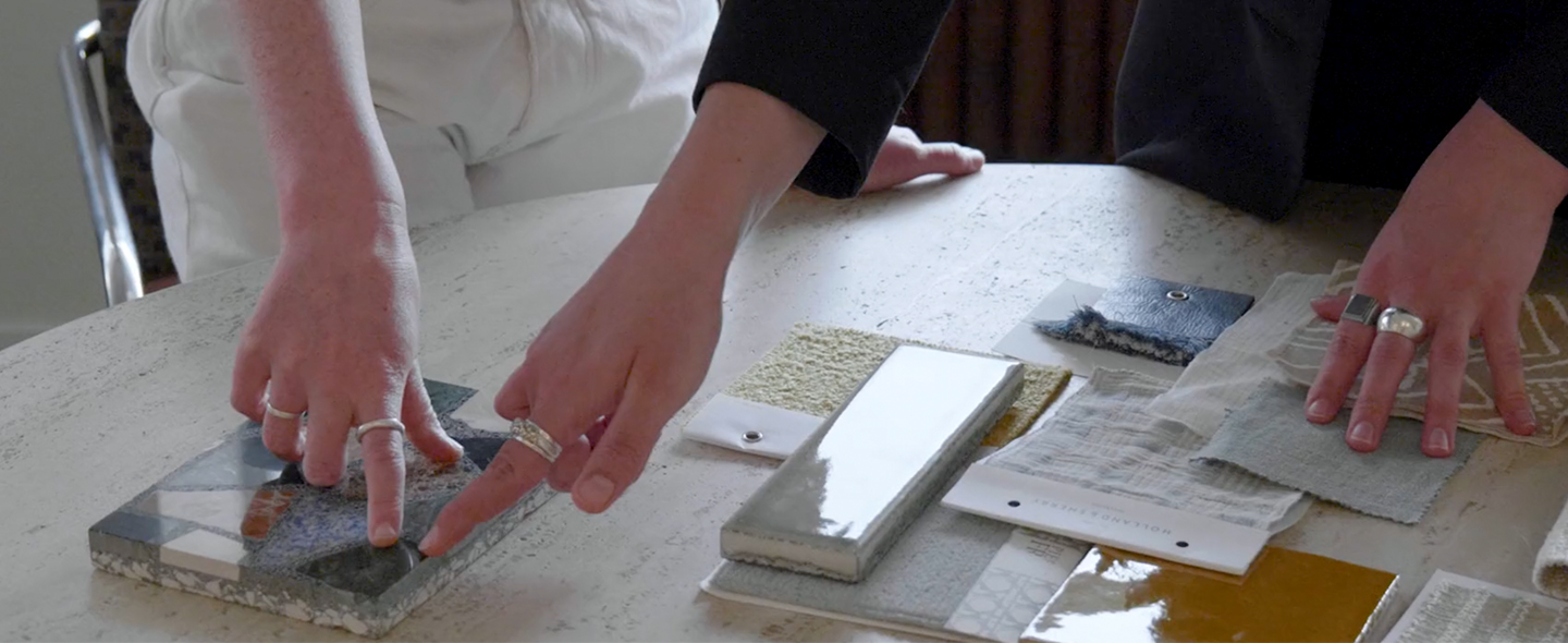 Hands pointing at tile samples