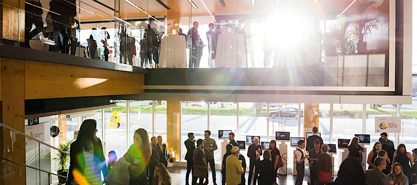 Lens flare photo of crowd at Grad Show