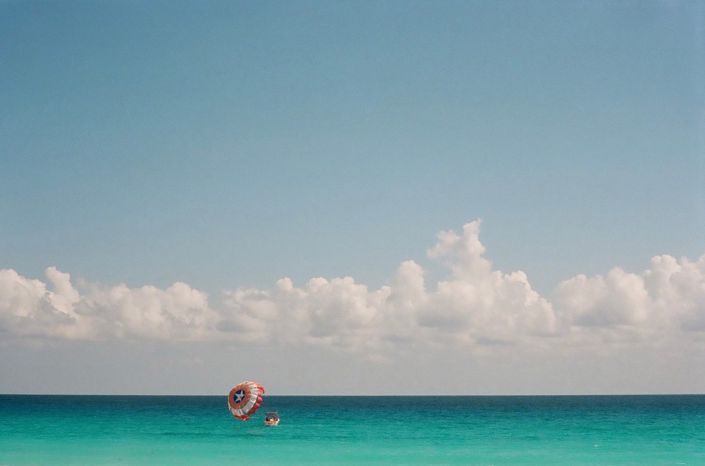 Boat with sail on the ocean