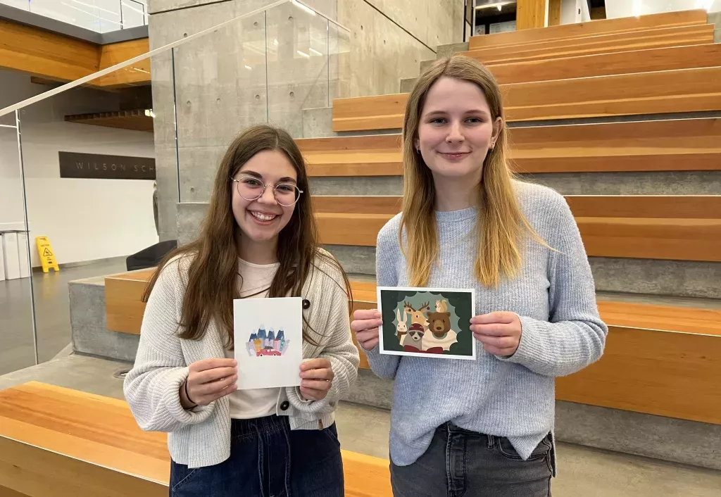 Monica And Sarah Holding cards